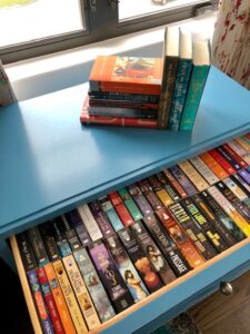 clever storage for books in master bedroom