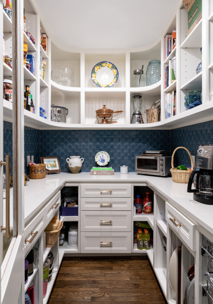 Tile in the pantry adds color and polish while also tying into the color scheme of the first floor backsplash tile in the pantry