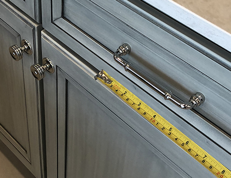 Measure the drawer pull length and the drawer length